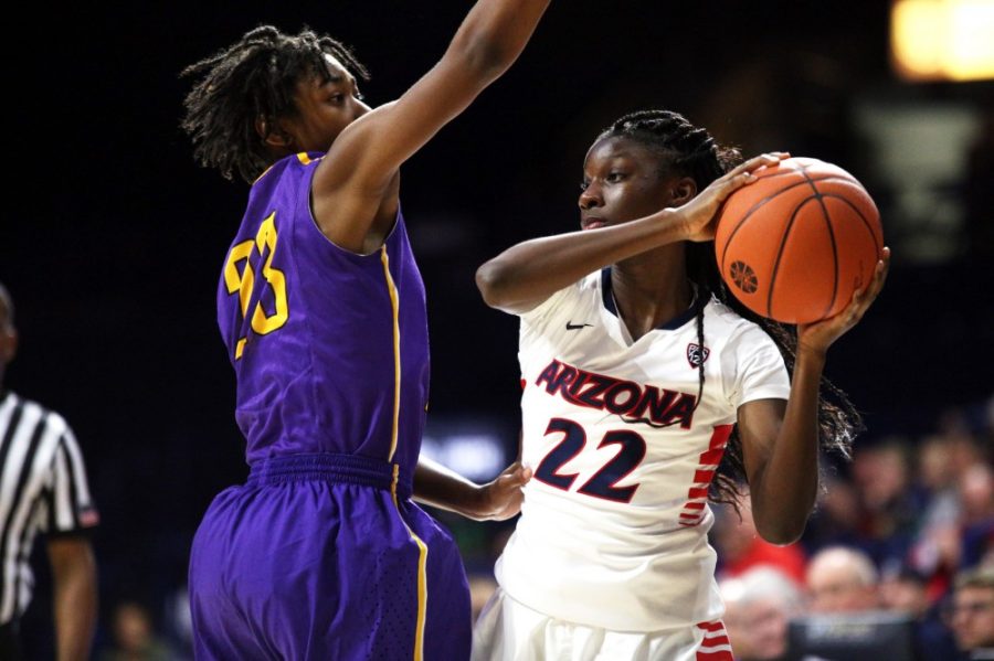 Arizona guard Bria Rice (22) looks to make a pass behind Western New Mexico guard Jeylynn Fields during Tuesdays exhibition game on Nov. 8 in McKale Center. Rice had three points in the exhibition opener for the Wildcats.