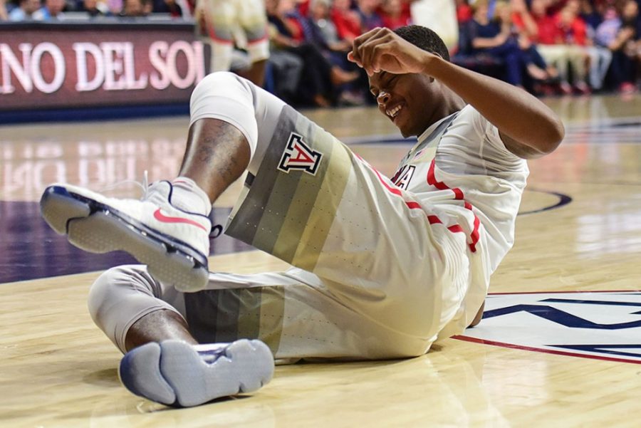 Arizona forward Ray Smith (24) grimaces as he fall injured to the ground during Arizonas blow-out 86-35 exhibition win over the College of Idaho at McKale Center on Tuesday, Nov. 1, 2016. 