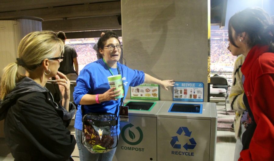 Alana Levine (center), Arizona State Universitys assistant director in facilities development and management, shows off Sun Devil Stadiums recycling and compost bins UA campus sustainability program coordinator Julia Rudnick (left) and student Celeste Colmenares (right) Thursday, Nov. 10 in Tempe. Sun Devil Stadium recycles 50 percent of its waste.