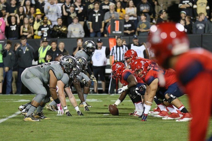 The Colorado Buffaloes and the Arizona Wildcats line up prior to the snap of the first Wildcat possession of the game at Folsom Field in Boulder, Colorado on Saturday, Oct. 17, 2015.