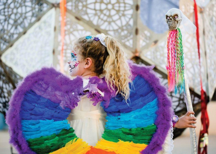 A young girl dressed as an angel participates in the All Souls Procession on Nov. 2, 2013. in Tucson, Ariz.