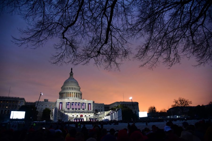 The United States Capitol building just as the sun starts to rise and attendees file in before the inauguration of President Donald Trump, in Washington D.C. on Friday, Jan. 20, 2017. (Photograph by Rebecca Noble)