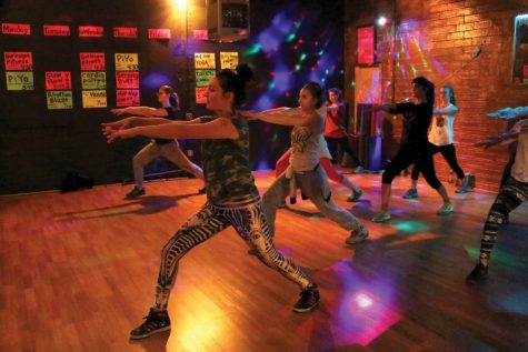 Marina Cornelius instructs her yoga class at Floor Polish in Tucson, Arizona on Jan. 25. Yoga is only one of the types of exercise the studio offers weekly.