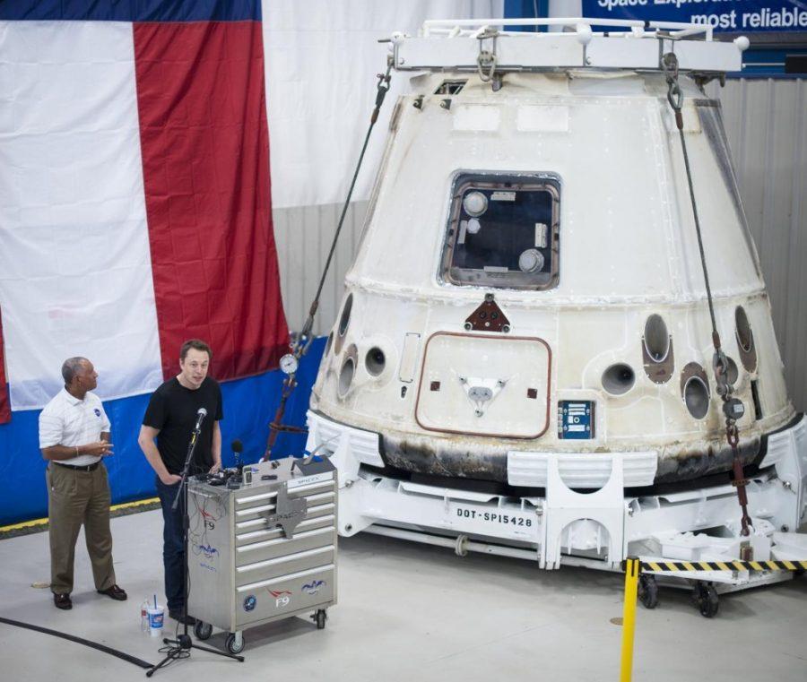 NASA Administrator Charles Bolden (left) and SpaceX CEO and Chief Designer Elon Musk, view the historic Dragon capsule that returned to Earth on May 31, 2012, following the first successful mission by a private company to carry supplies to the International Space Station on Wednesday, June 13, 2012 at the SpaceX facility in McGregor, Texas. After the temporary setback of a rocket explosion last year, SpaceX successfully launched and recovered a new rocket last week.