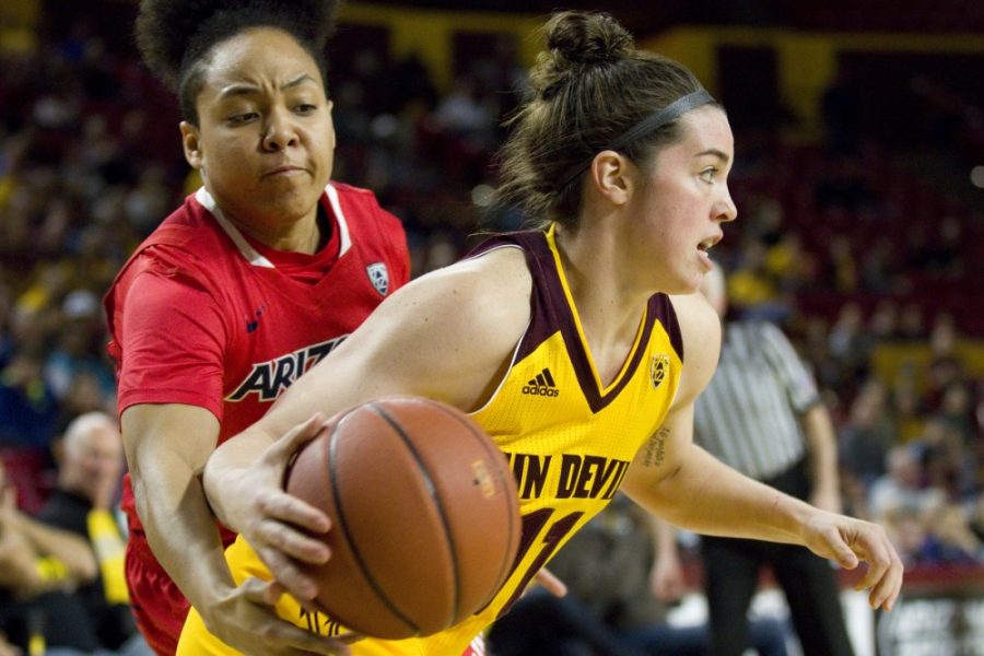 ASU freshman guard Robbi Ryan (11) drives baseline while Wildcats guard Malena Washington reaches in to try and steal the ball during a womens basketball game against the University of Arizona Wildcats in Wells Fargo Arena in Tempe, Arizona on Sunday, Feb. 19, 2017. ASU won the game 67-54. (Josh Orcutt/State Press)