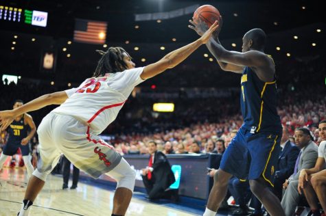 Arizona player Keanu Pinder (25) blocks a California player during the Men's Basketball game in McKale Center on Feb. 11.
