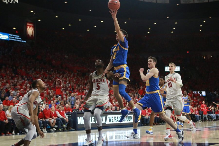 UCLAs Lonzo Ball (2) attempts to shoot the ball over Arizonas Kadeem Allen (5) during the mens basketball game on Feb. 25 in McKale Center.