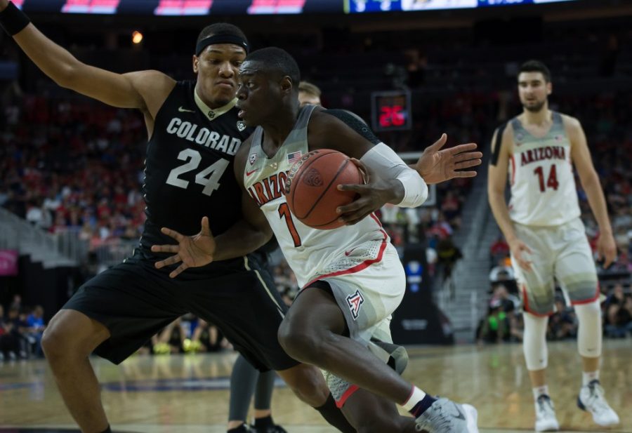 <p>Arizona's Rawle Alkins (1) pounds past Colorado's George King (24) during the PAC12 quarterfinals in Las Vegas, on Thursday, March 9. The Wildcats beat the Buffaloes 92-78. </p>