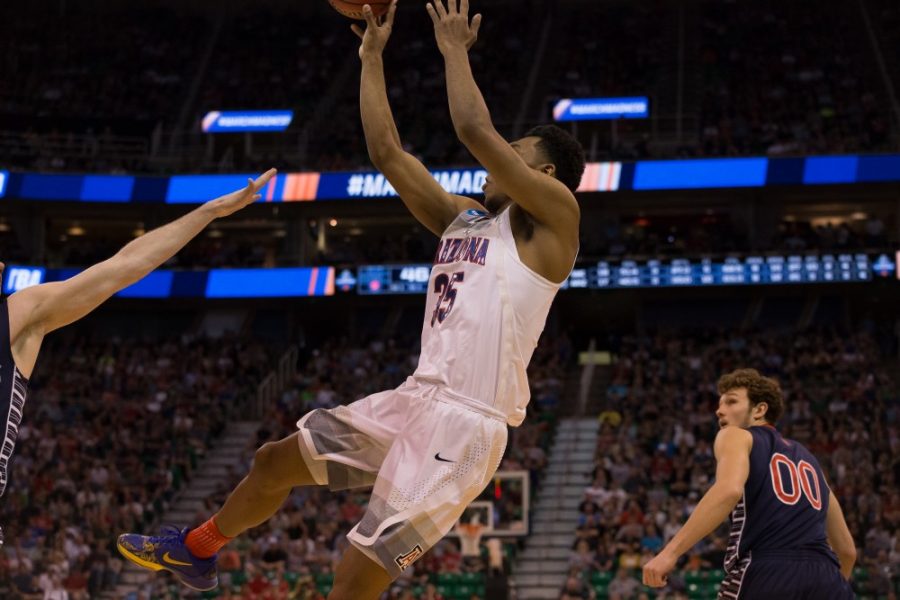 Arizonas+Allonzo+Trier+%2835%29+makes+a+shot+as+he+falls+backwards+during+the+Arizona-Saint+Marys+game+on+Saturday%2C+March+18.