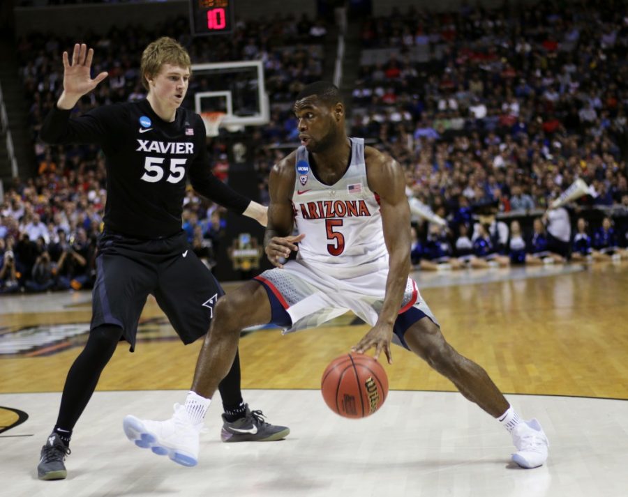 Arizona senior guard Kadeem Allen (5) drives past Xavier guard J.P. Macura (55) during the second half of the Arizona vs Xavier Sweet 16 matchup on Thursday, March 23. Wildcats lost to Xavier Musketeers 73-71.