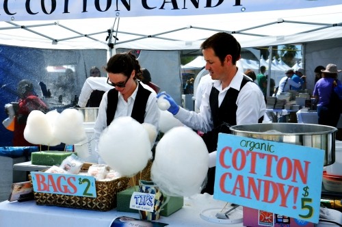 Kate Keelen and Nick Breckenfeld prepare cotton candy at Fluff it Up, an organic cotton candy stand at the Tucson Festival of Books on the UA mall in 2014. The festival generates millions of dollars for the local Tucson economy.