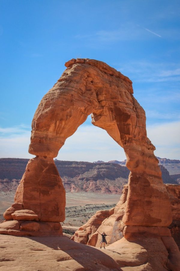 Rebecca Delao stands underneath Delicate Arch in Arches National Park on Sunday, March 12. 