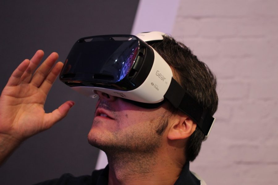 A man using the Samsung Gear virtual reality set. Despite its many benefits, VR still faces challenges including eyestrain and high price.