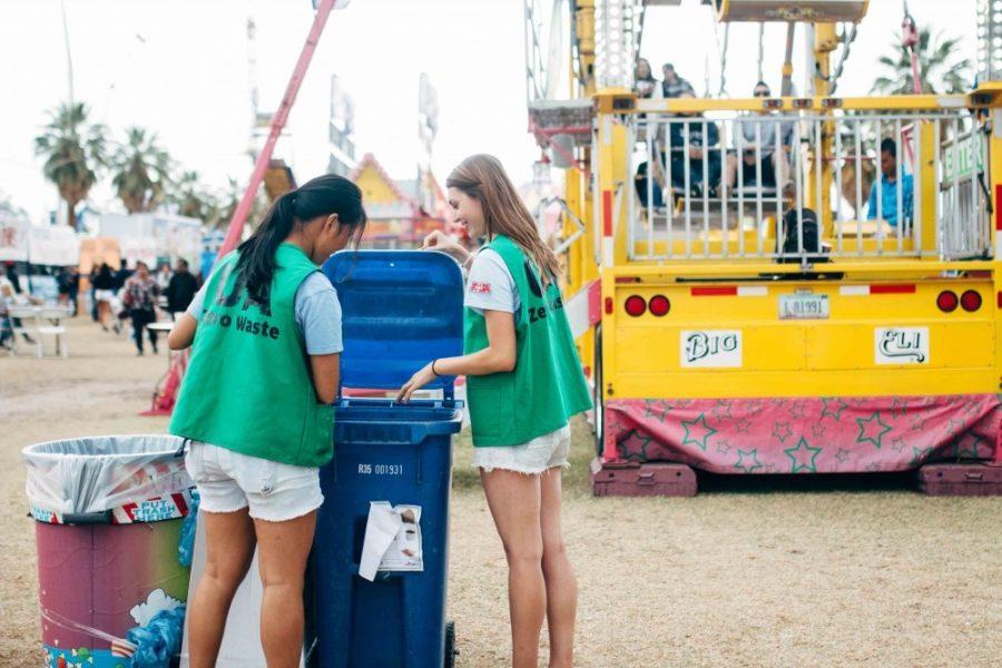 Sarah Bertram, a sophomore studying physiology and molecular and cellular biology, and Lia Ossanna, an environmental science freshman, collect trash and recycling from Spring Fling on April 10, 2016. Students for Sustainability have expanded their efforts at Spring Fling this year.