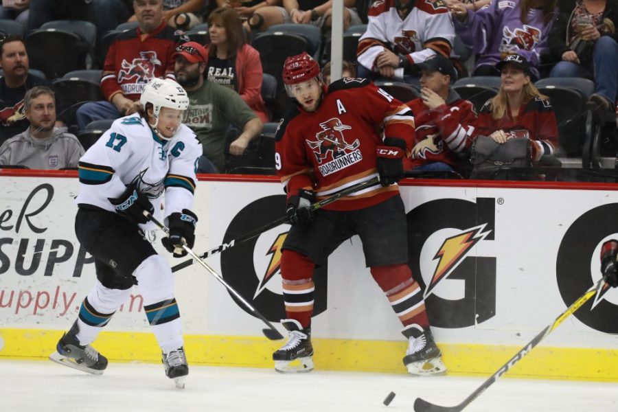 <p>Roadrunner Alternate Captain, Chris Mueller looks for a pass while being covered by San Jose Barracuda captain, John McCarthy on March 26.</p>