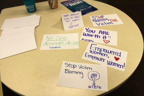 Table with encouraging posters made by attendees for the HIV/AIDS talk at the Center for Student Involvement and Leadership on Tuesday, April 18.