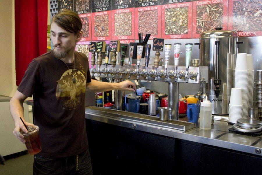Rob Villa, a barista at Scented Leaf Tea House and Lounge, mixes customers drinks on Jan. 22, 2015. The store brews specialty and house teas and sells fresh, seasonal pastries. 
