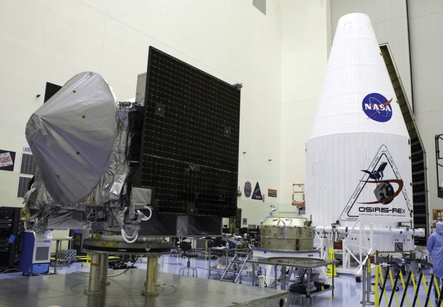 OSIRIS-REx is prepared for encapsulation in its payload fairing in 2016. This February, the probe searched for Trojan asteroids that accompany Earth in its solar orbit.
