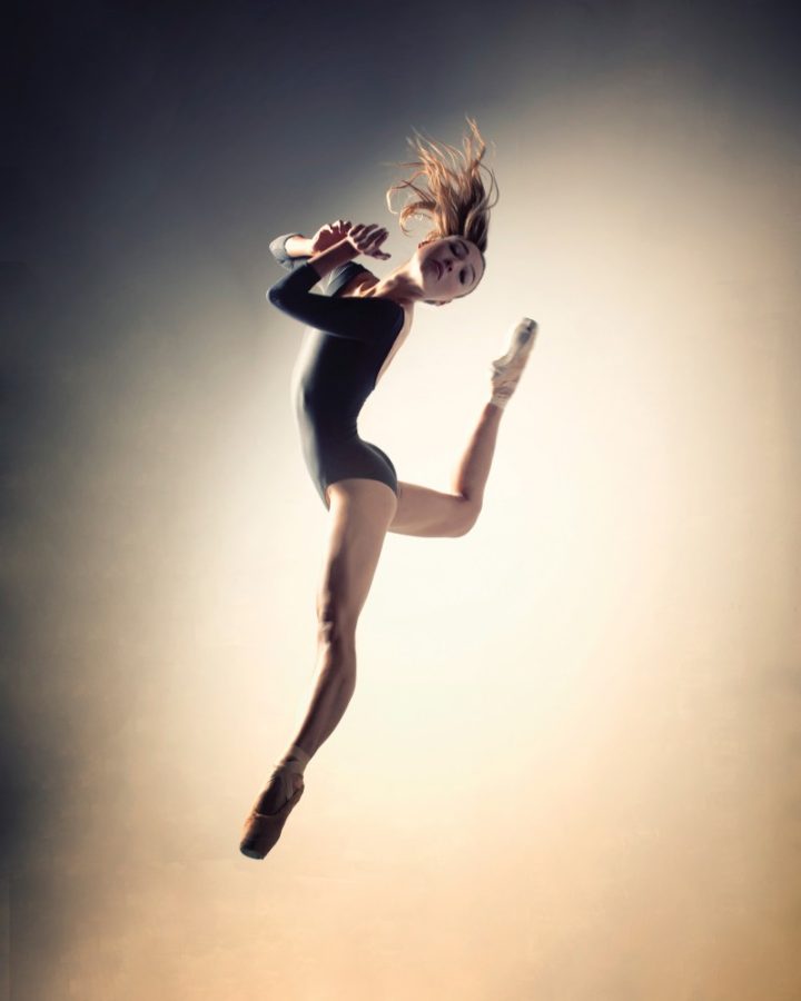 Graduating senior Elena Carter mid-air while dancing. Carter is graduating this semester with a Bachelor of Fine Arts in dance and a Bachelor of Arts in mathematics with a minor in finance.