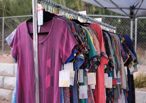 Clothing on display from LuLaRoe, which sells women's skirts and dresses, during the Sabino Canyon Sunset Bazaar at Three Canyons Beer and Wine Garden on Wednesday, June 28 in Tucson, Ariz. The event was organized by Art Lounge Productions to showcase the creations of local businesses.