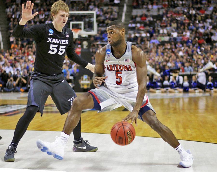 Former Arizona guard Kadeem Allen (5) drives past Xavier guard J.P. Macura (55) during the second half of the Arizona vs Xavier Sweet 16 matchup on Thursday, March 23. Allen was selected by the Boston Celtics with the 53rd overall pick in the second round of the NBA Draft.