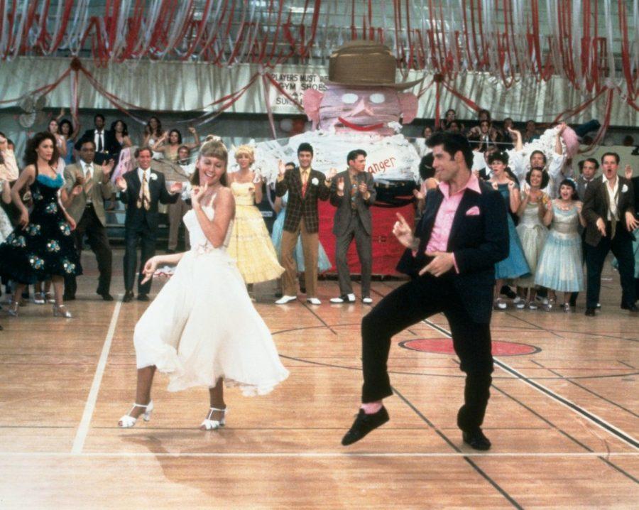John Travolta, right, and Olivia Newton-John, left, in the original making of Grease in 1978. Cactus Drive-In Theatre Foundation will be showing the movie at the Tanque Verde Swap Meet on Thursday, July 27 as a drive-in movie.