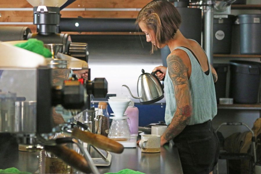Meredith ONeil prepares to serve coffee to patrons on Sunday, Aug. 20 at Presta Coffee Roasters. Baristas are trained to a high standard that includes technical coffee production skills, as well as coffee culture and terroir factors that impact bean flavor profiles.