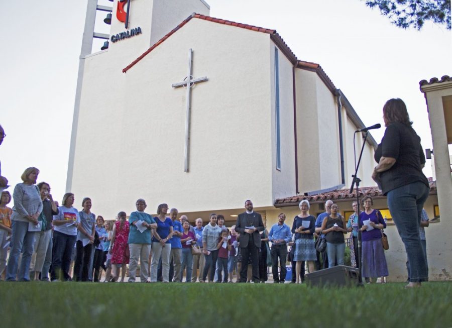 Senior Pastor Dottie Escobedo-Frank welcomes the crowd to the Catalina United Methodist Church for the DACA Vigil on Sept. 10. Escobedo-Frank told the crowd how her grandmother came across the Rio Grande River pregnant to have her son, Escobedo-Franks father, in America so that he could avoid the violence of Mexico.