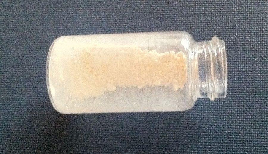 Sunscreen particles in a vial. Most commercial sunscreens use organic compounds that can degrade into health-harming radicals when struck with UV rays.