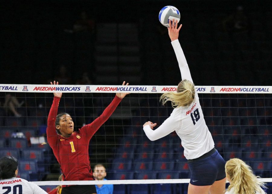 Arizona middle blocker Mckenzie Jacobson (18) tips the ball over the net during Arizonas 3-2 win against USC on Nov. 2, 2016 in McKale Center. Jacobson has only been seen on the court for 29 sets in 20 matches so far during the 2017 season. 