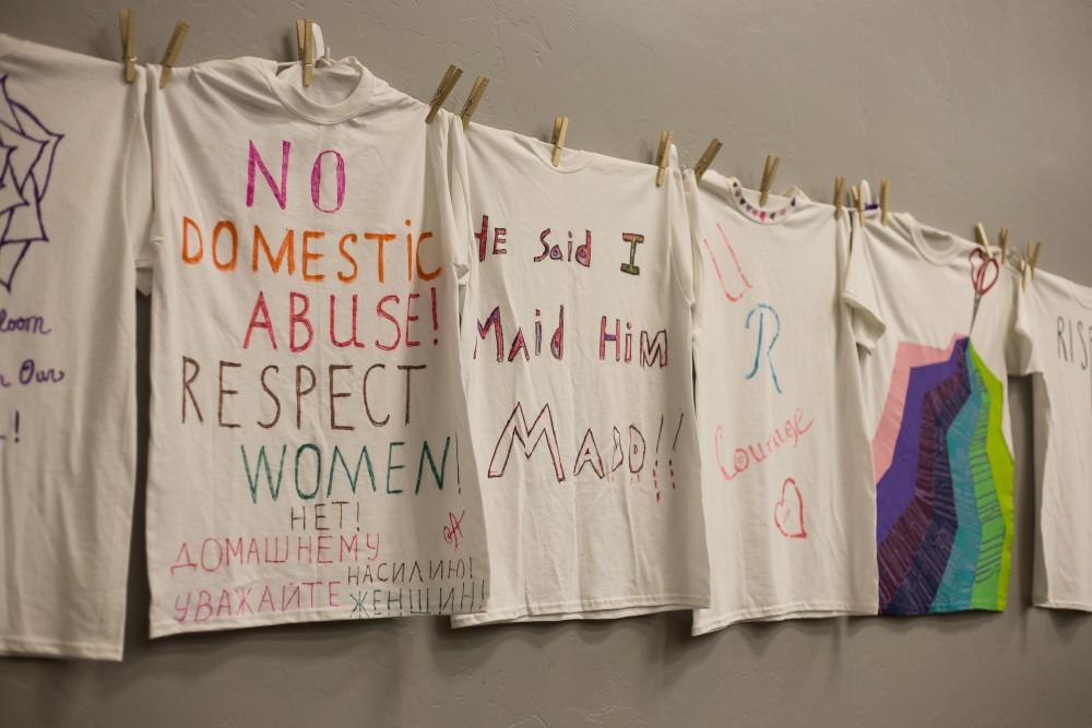 Shirts hung by the Clothesline Project adorn the walls of the Galleria at the YWCA on Jan. 6.