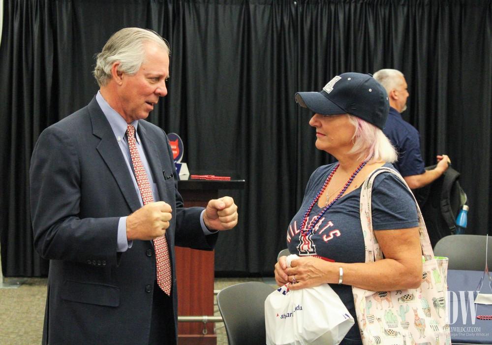 Beth Brizsl, a University of Arizona parent from Chandler, Ariz., introduces herself to UA President Dr. Robert Robbins during Family Weekend.