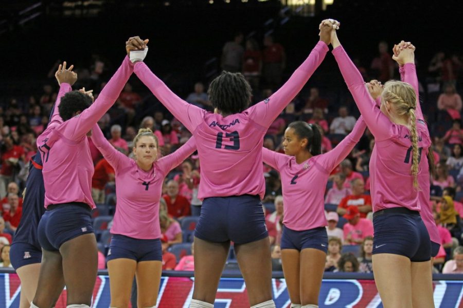 The+Arizona+volleyball+team+holds+hands+before+their+game+against+Utah+on+Oct.+13+in+McKale+Center.