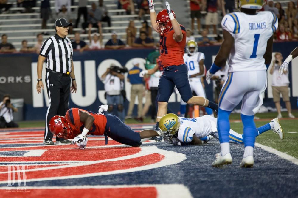 Arizona's DJ Hinton scores a touchdown against UCLA during the UA-UCLA game on Saturday, October 14.