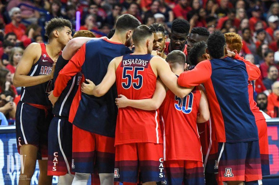 The Arizona mens basketball team huddles together before the McDonalds Red-Blue game on Oct. 20 in McKale Center.