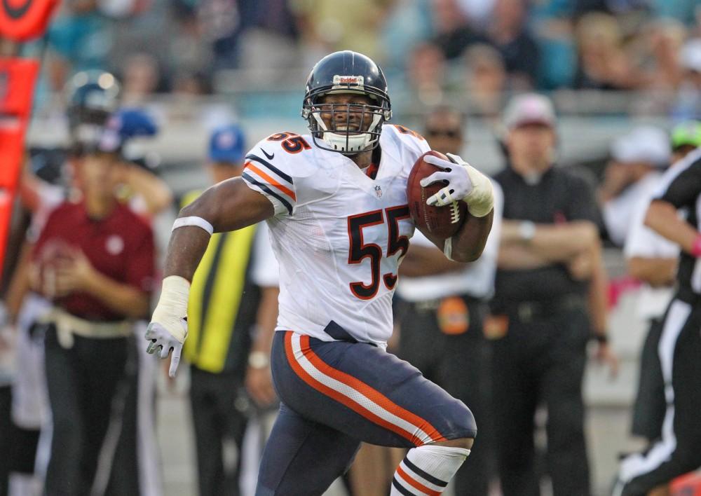 Chicago Bears outside linebacker Lance Briggs (55) smiles as he runs into the end zone after his interception for a touchdown against the Jacksonville Jaguars during the second half of their game at EverBank Stadium in Jacksonville, Florida, on Oct. 7, 2012.