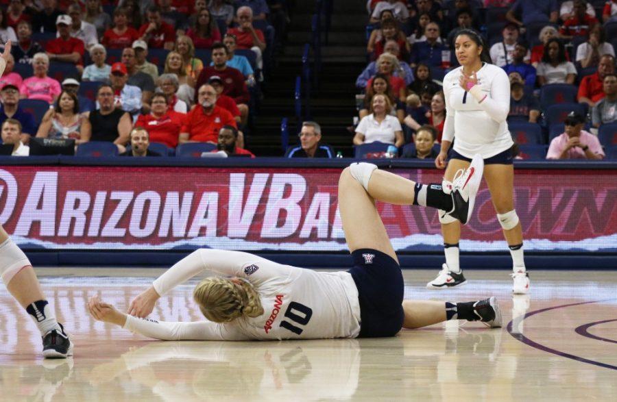 Arizona outside hitter Paige Whipple (10) falls on the court during the UA-Colorado volleyball match on Oct. 15 in McKale Center.