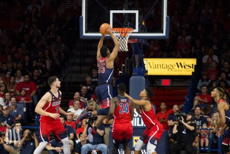 Allonzo Trier (35) dunks on opposing players during the Red-Blue game on Friday, October 20.