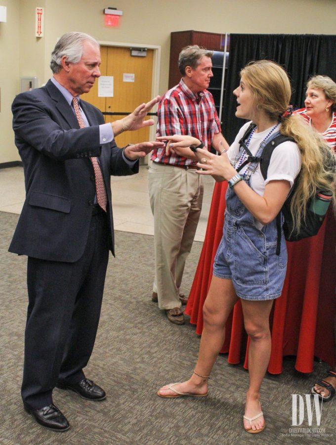 Grace Barker, a University of Arizona student double majoring in Law and Environmental Studies, talks with UA President Dr. Robert Robbins at his meet and greet during Family Weekend on Oct. 13.