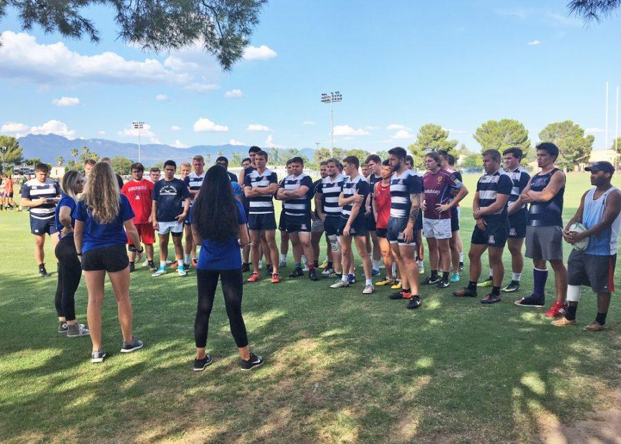 Nutritional Sciences students Cassidy Bell, Vanessa Ovando and Alyssa O’Connell talk with the University of Arizona mens rugby team about sports nutrition and hydration. The students measure body mass, hydration levels and diet to help the athletes improve.