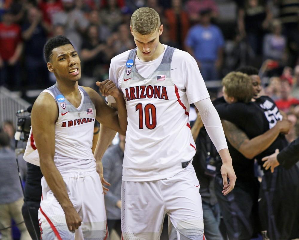 Sophomore guard Allonzo Trier, left, cries to teammate Lauri Markkanen, right, after Wildcats' 73-71 loss to Xavier Musketeers in the Sweet 16 matchup on March 23.