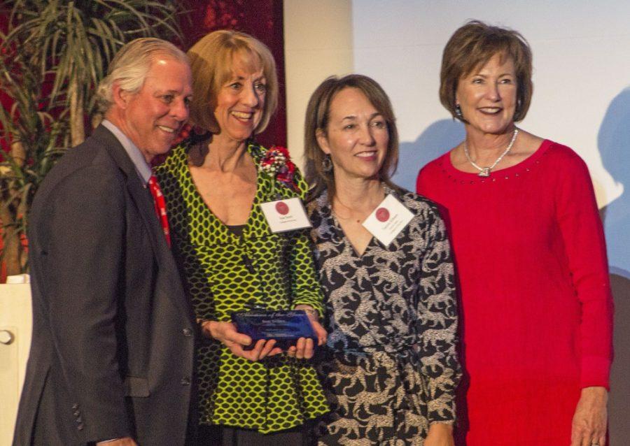 Sue Scott, center left, a professional actress and University of Arizona  alumna, accepts the Alumni of the Year award on Oct. 27. 