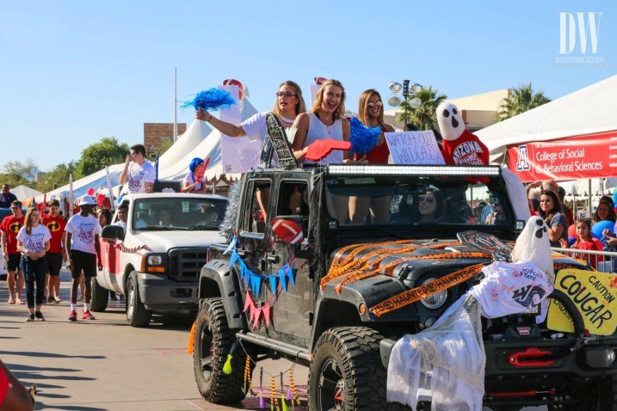 Participants of the Homecoming parade in a Halloween decorated car on Oct. 28.