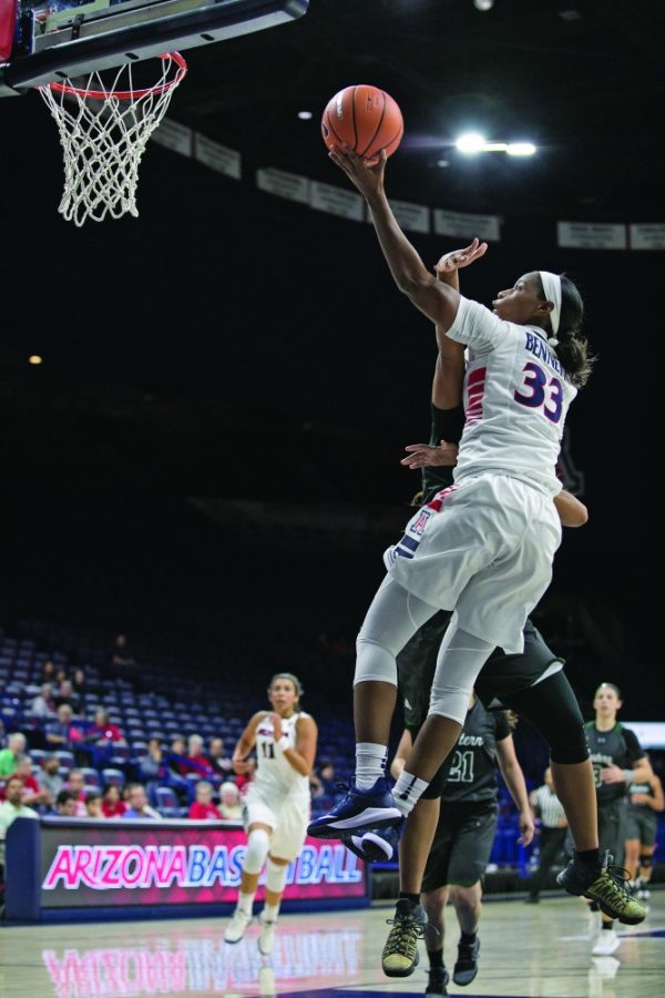 Arizonas JaLea Bennett jumps to lay in the ball with a soft touch past an Eastern New Mexico defender during the UA-ENM exhibition game on Oct. 30 in McKale Center. Bennet finished the game with 35 points and 10 rebounds.