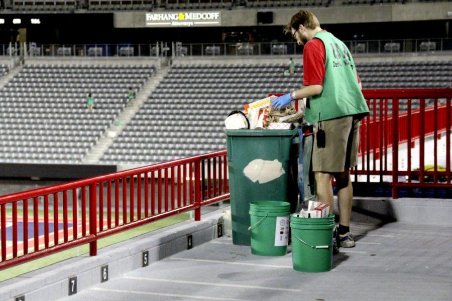 Ben Champion, director of the Office of Sustainability, sorts waste from the PAC-12 Zero Waste challenge during the homecoming football game on Oct. 29, 2016. The UA Office of Sustainability alongside student organizations help solve the problem of removing trash from campus and the football stadium every year. 