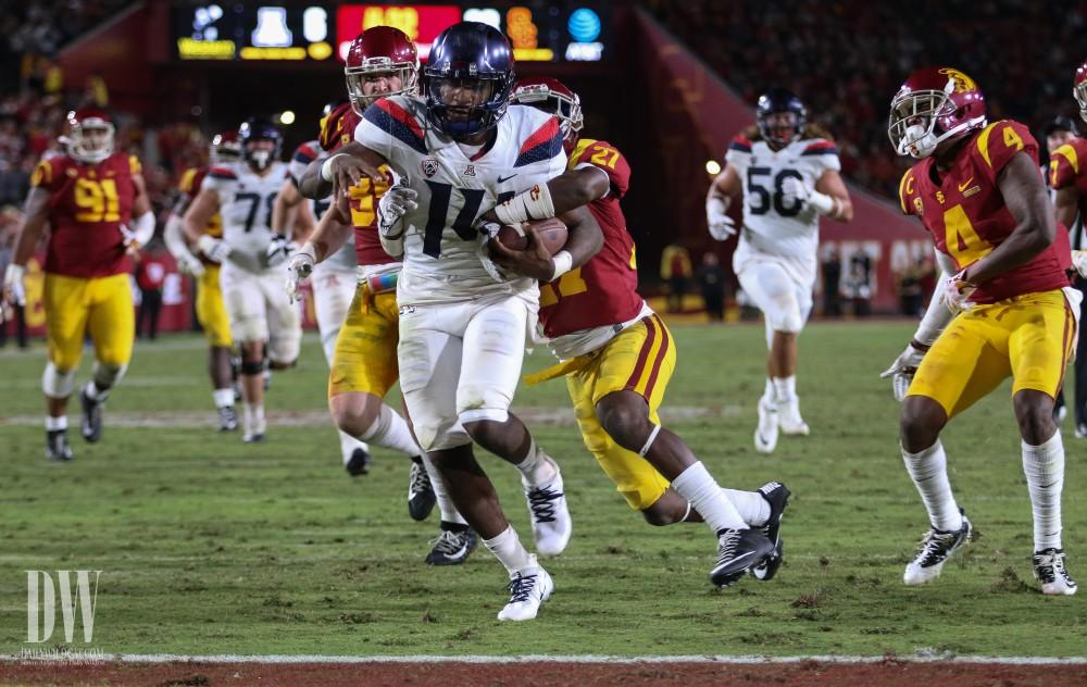 Arizona's Khalil Tate (14) scores a touchdown against USC. Arizona lost 49-35.
