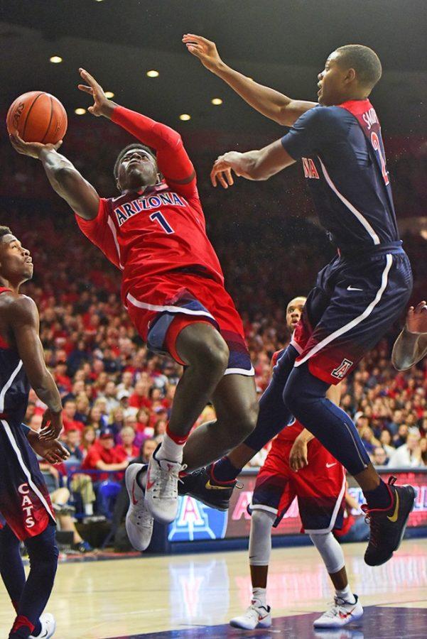 Arizona guard Rawle Alkins (1) tries to clear a shot past Arizona forward Ray Smith (24) during the Red-Blue game at McKale Center on Oct. 14, 2016.