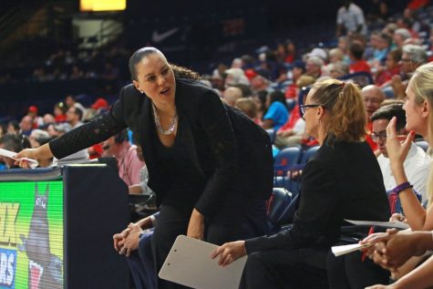Arizona women's basketball head coach Adia Barnes signals at Charise Holloway to step in during Arizona's 74-59 win against Alcorn State on Nov. 13, 2016 in McKale Center.