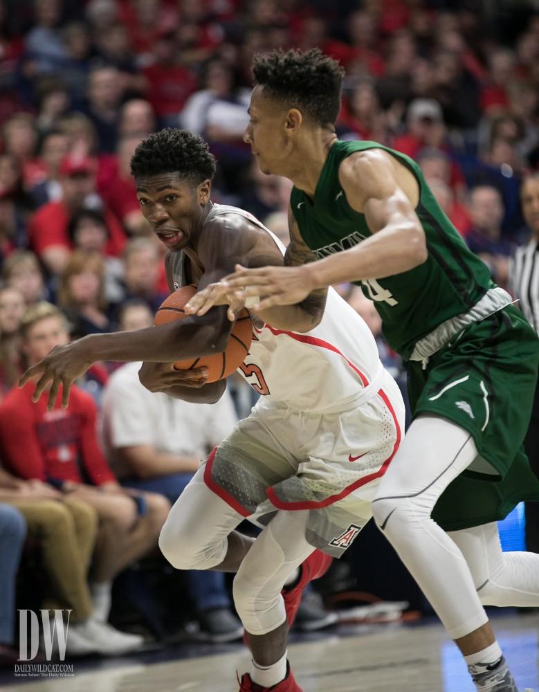 Arizona's Brandon Randolph muscles his way past an ENMU defender. Randolph had 14 points in the game.