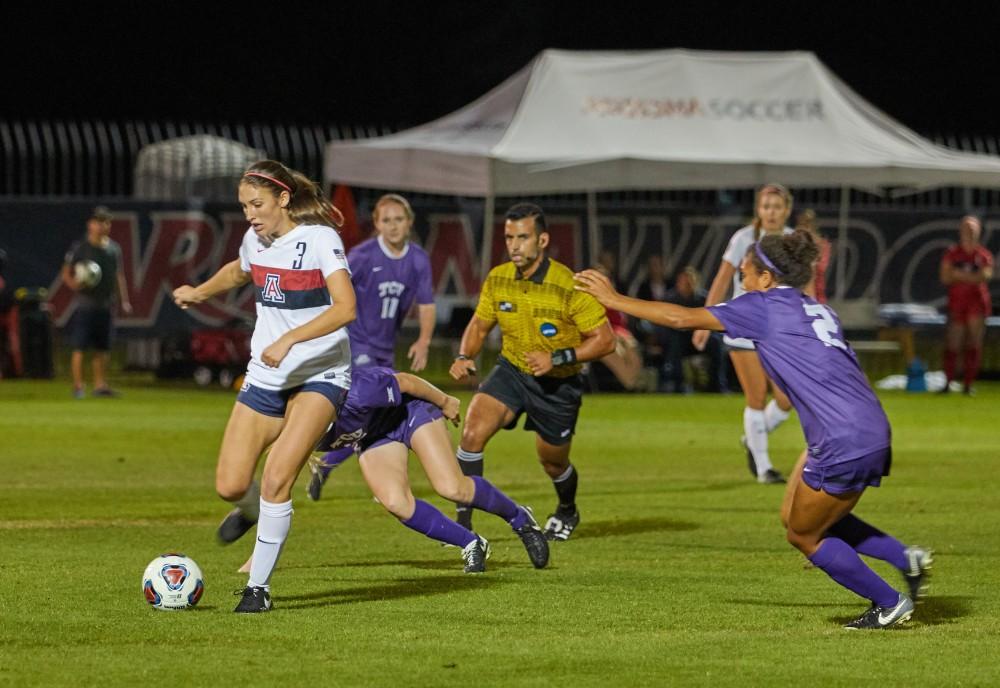 Arizona midfielder Cali Crisler moves past Texas Christian University defense during the first round of NCAA tournament on Nov. 10. Crisler scored one point for the Wildcats.